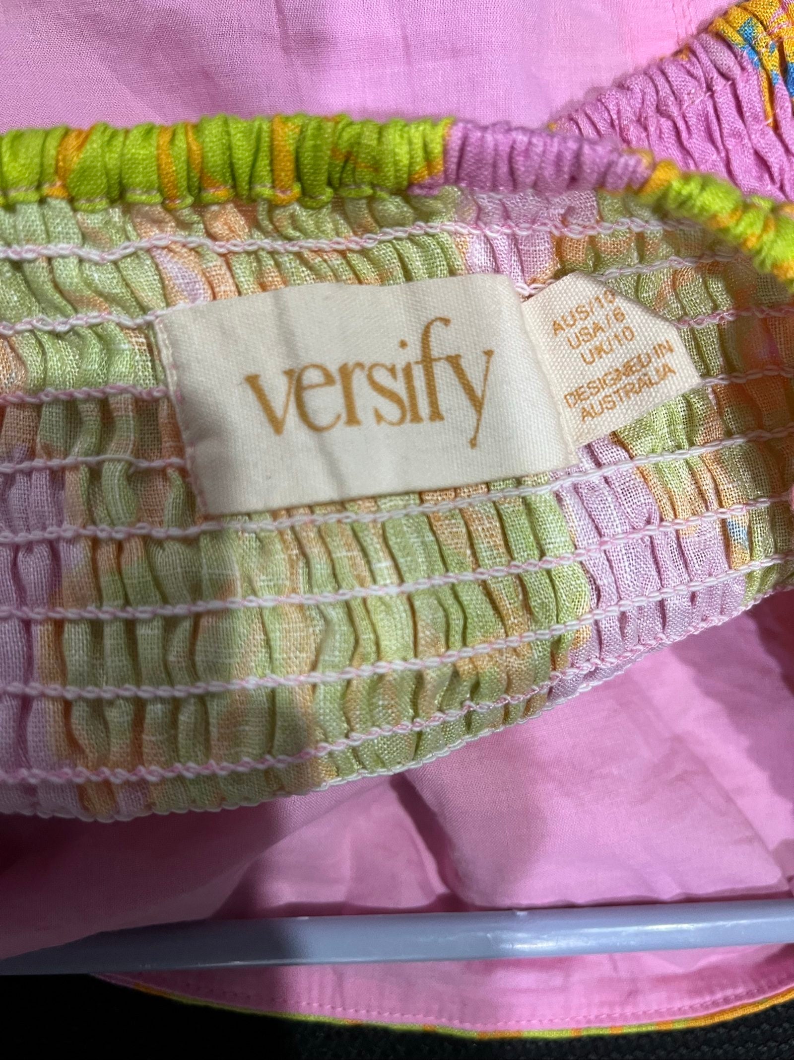 Versify floral crop top in pink, green, and orange, wide straps, smocked back, linen material.