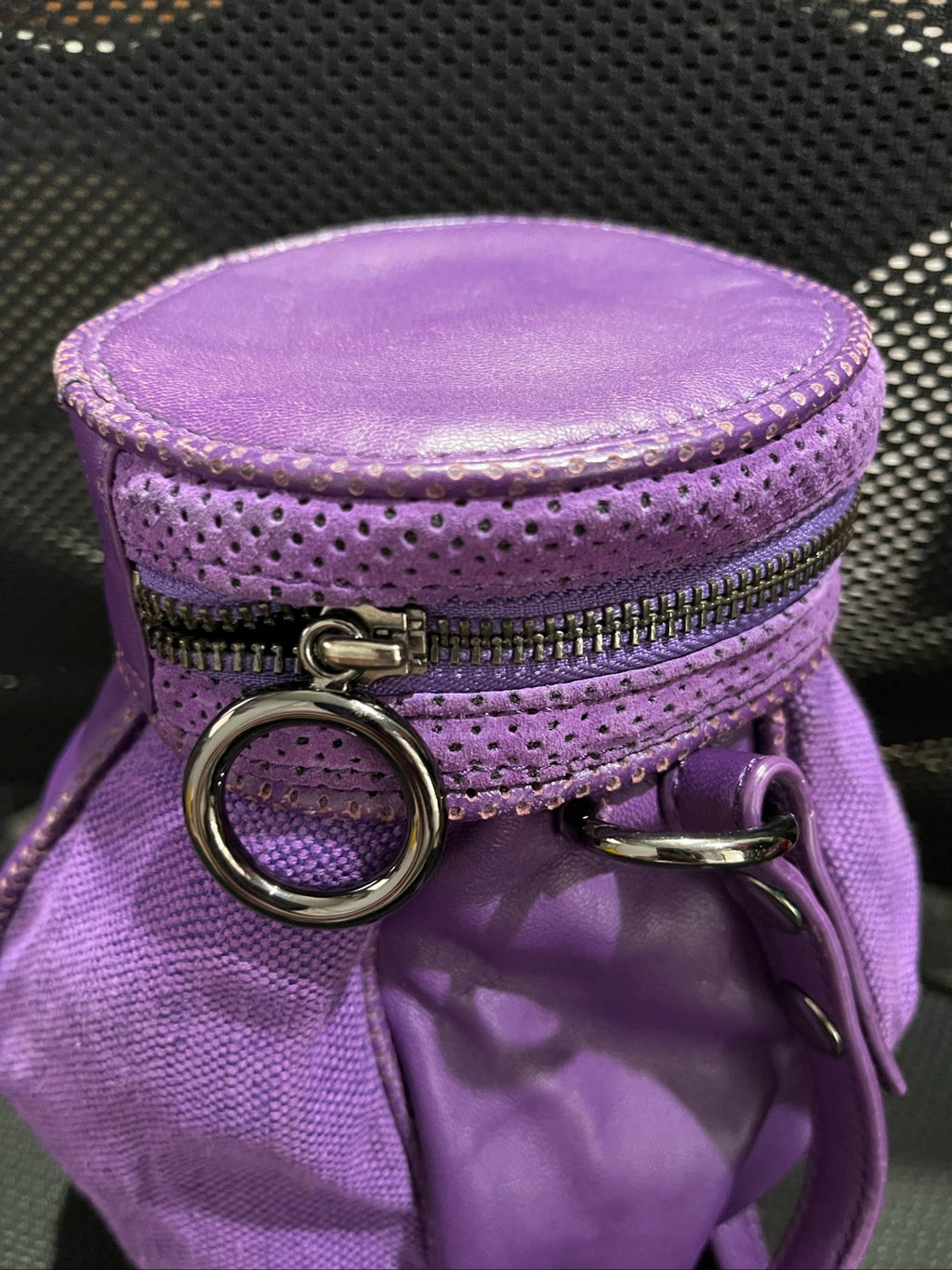 MIMCO purple leather and canvas drawstring crossbody bag with embossed logo and large ring pull.