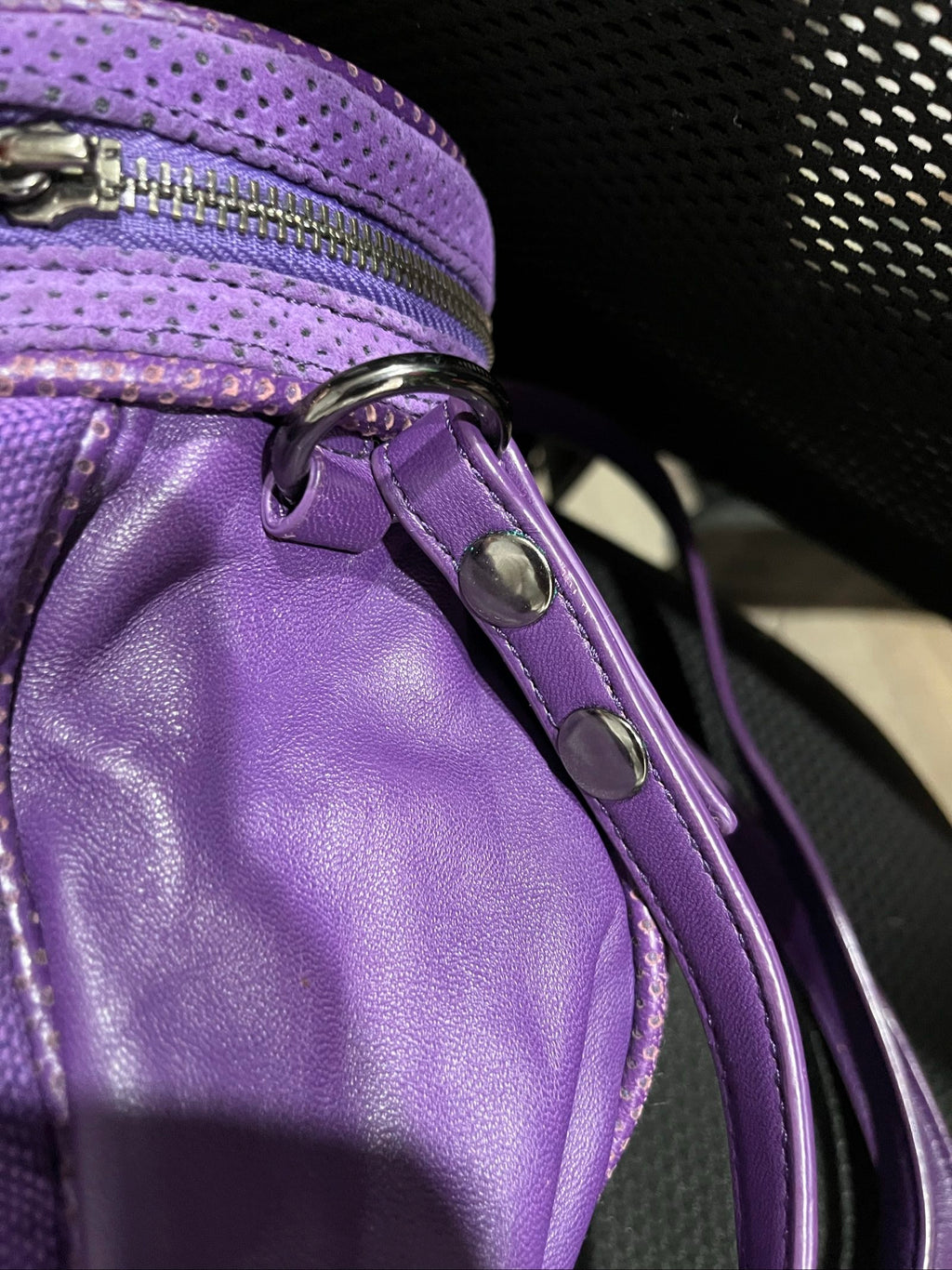 MIMCO purple leather and canvas drawstring crossbody bag with embossed logo and large ring pull.