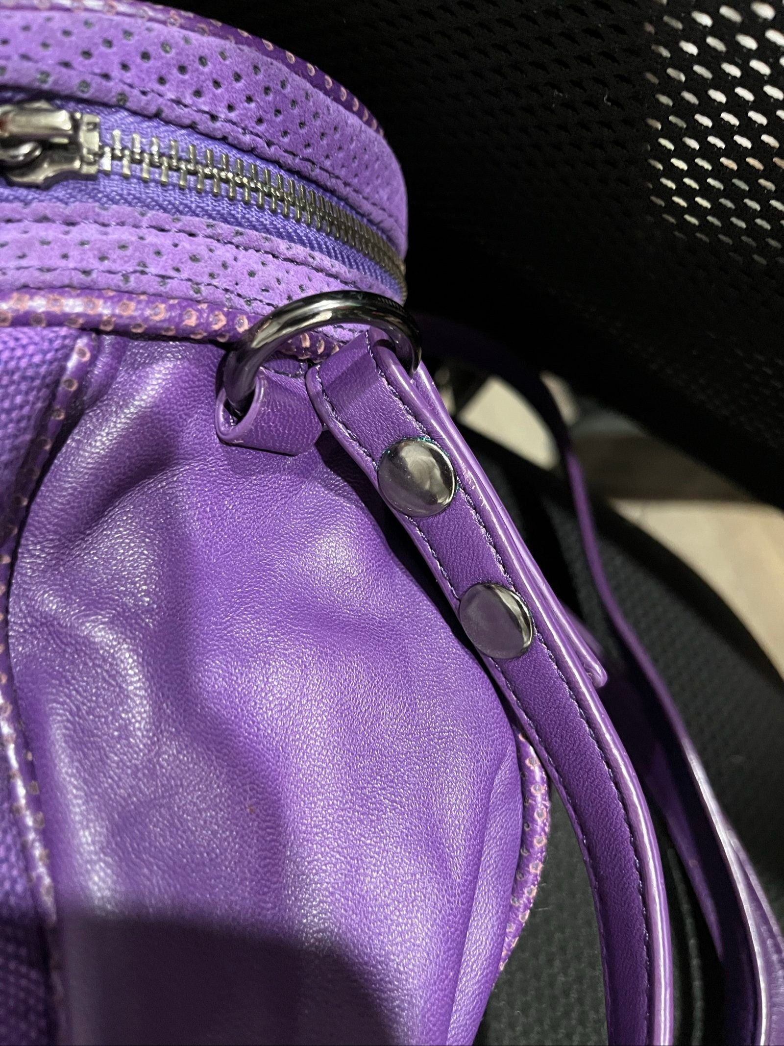 MIMCO purple leather and canvas drawstring crossbody bag with embossed logo and large ring pull.