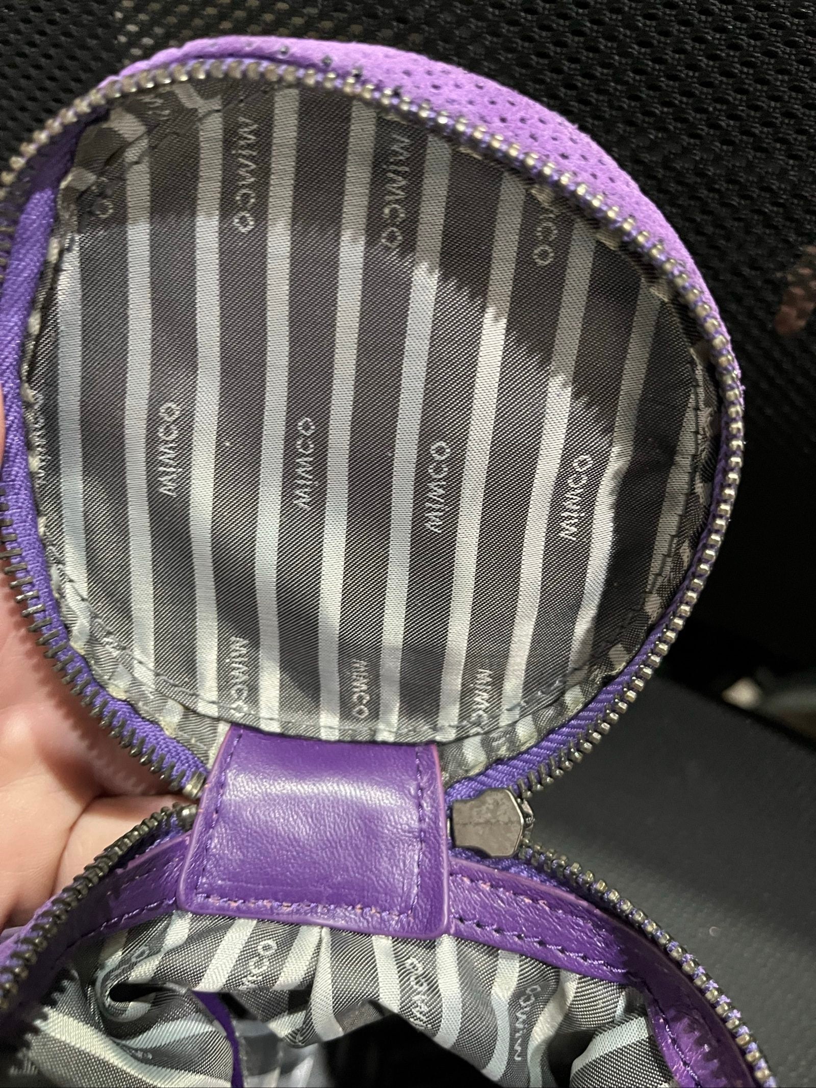 MIMCO purple leather and canvas drawstring crossbody bag with embossed logo and large ring pull.