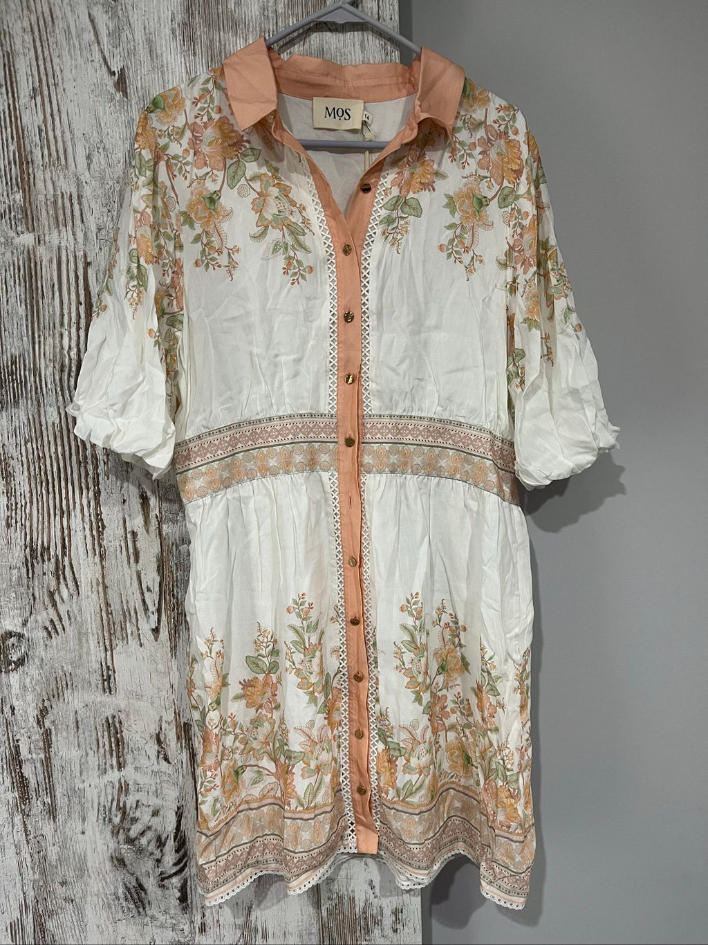 Mos green and white floral border print shirt dress with lace trims and gold-tone buttons.
