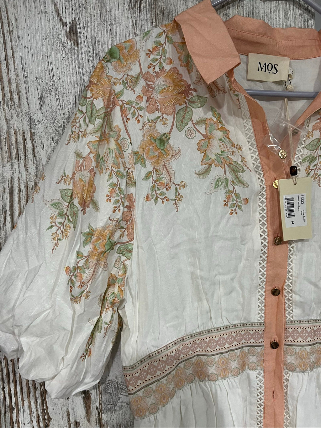 Mos green and white floral border print shirt dress with lace trims and gold-tone buttons.