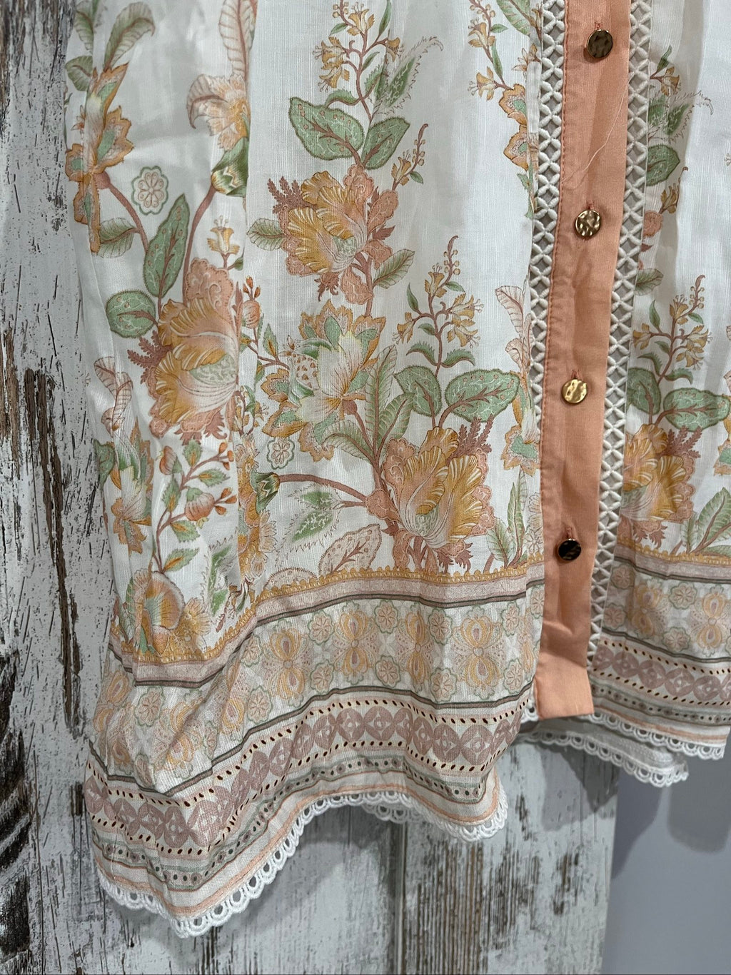 Mos green and white floral border print shirt dress with lace trims and gold-tone buttons.