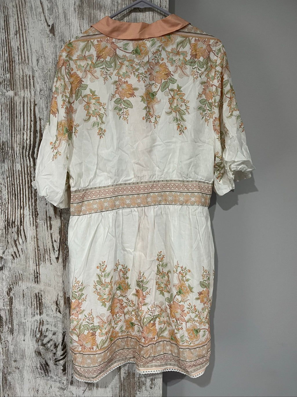 Mos green and white floral border print shirt dress with lace trims and gold-tone buttons.