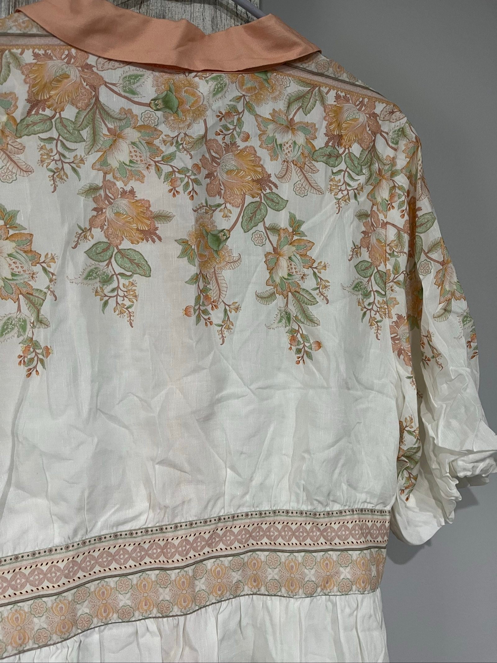 Mos green and white floral border print shirt dress with lace trims and gold-tone buttons.