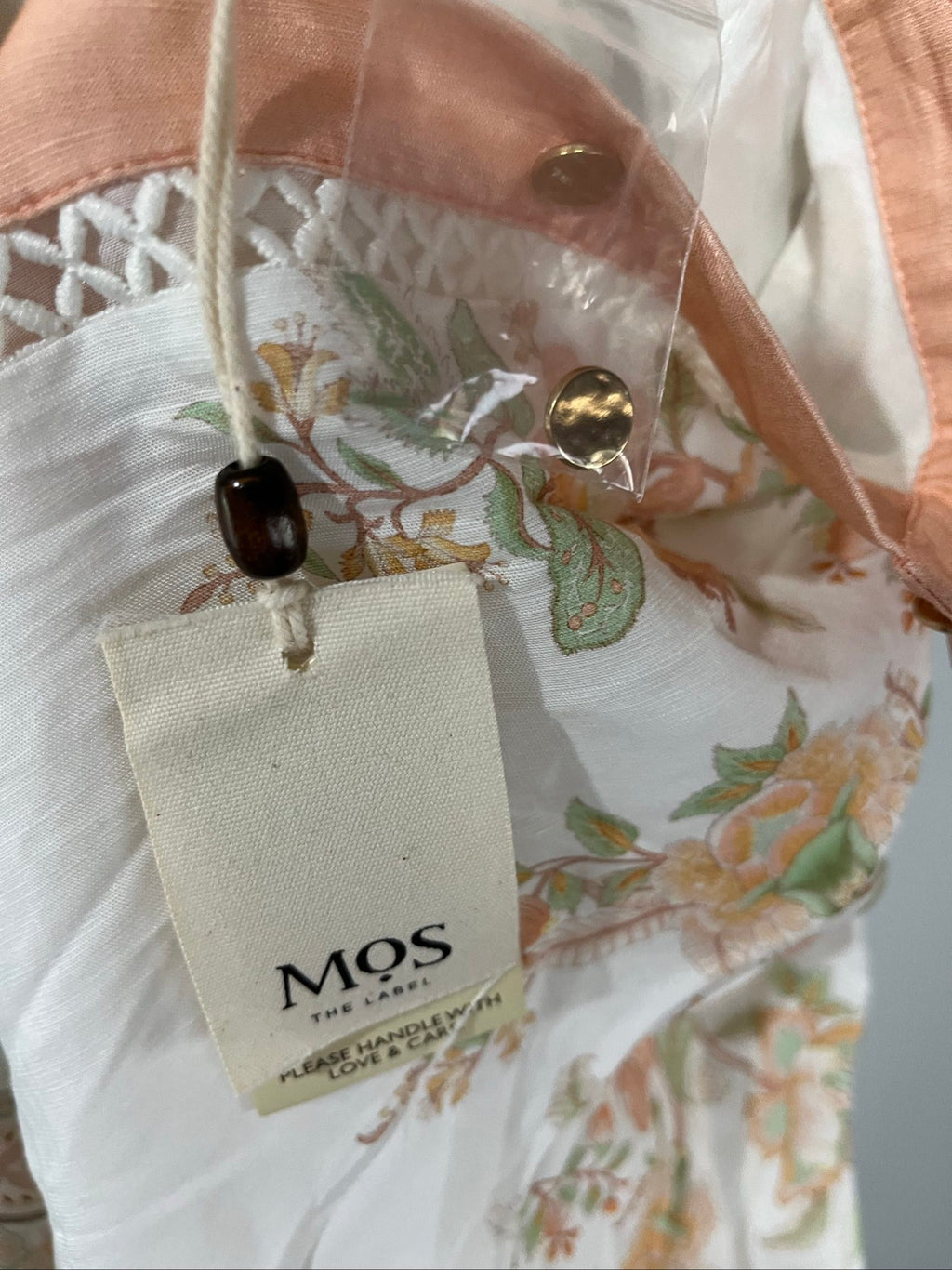Mos green and white floral border print shirt dress with lace trims and gold-tone buttons.