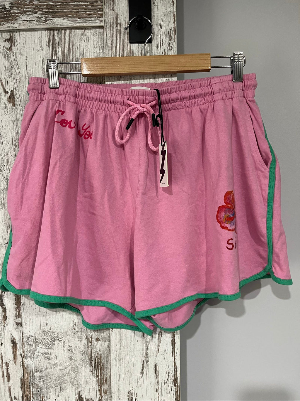 SABBI pink and green floral print casual shorts with elastic drawstring waistband and back pocket.