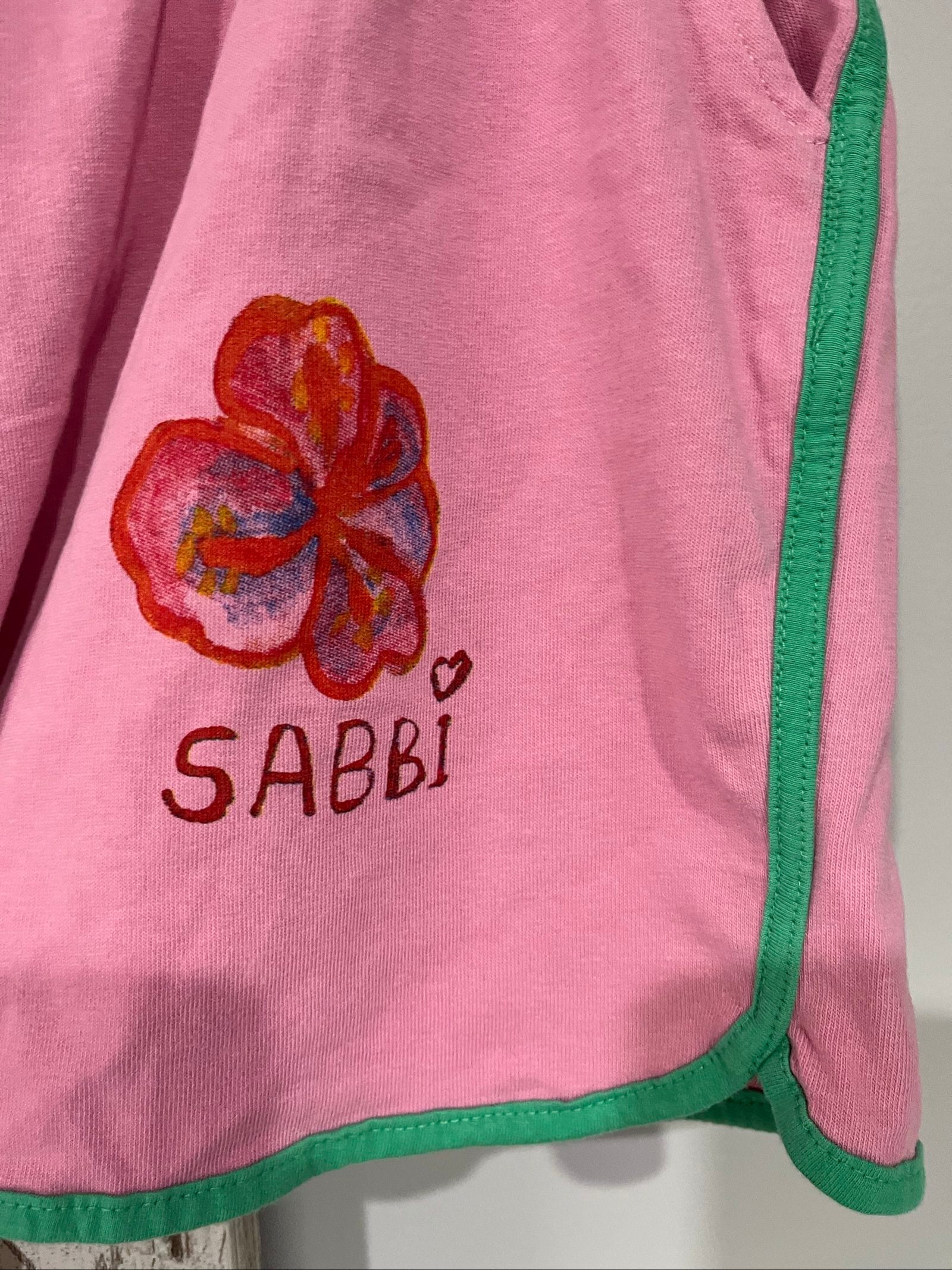 SABBI pink and green floral print casual shorts with elastic drawstring waistband and back pocket.