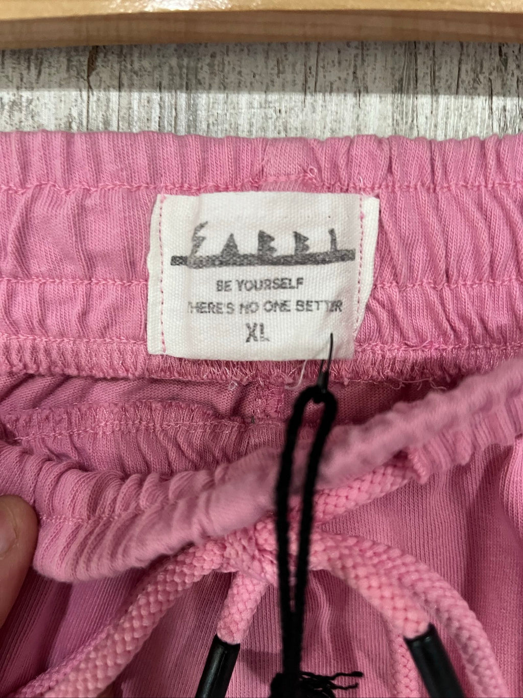 SABBI pink and green floral print casual shorts with elastic drawstring waistband and back pocket.