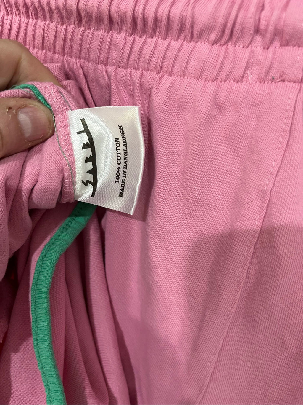 SABBI pink and green floral print casual shorts with elastic drawstring waistband and back pocket.