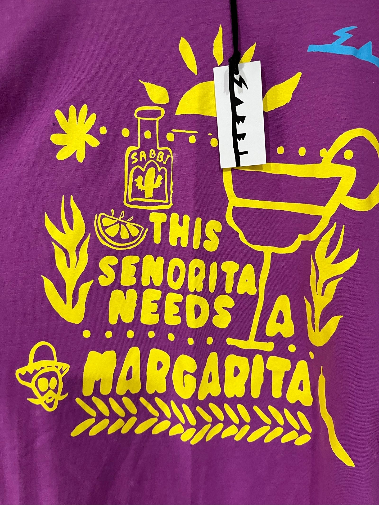 SABBI vintage graphic t-shirt purple with bold yellow front and multicoloured back print.