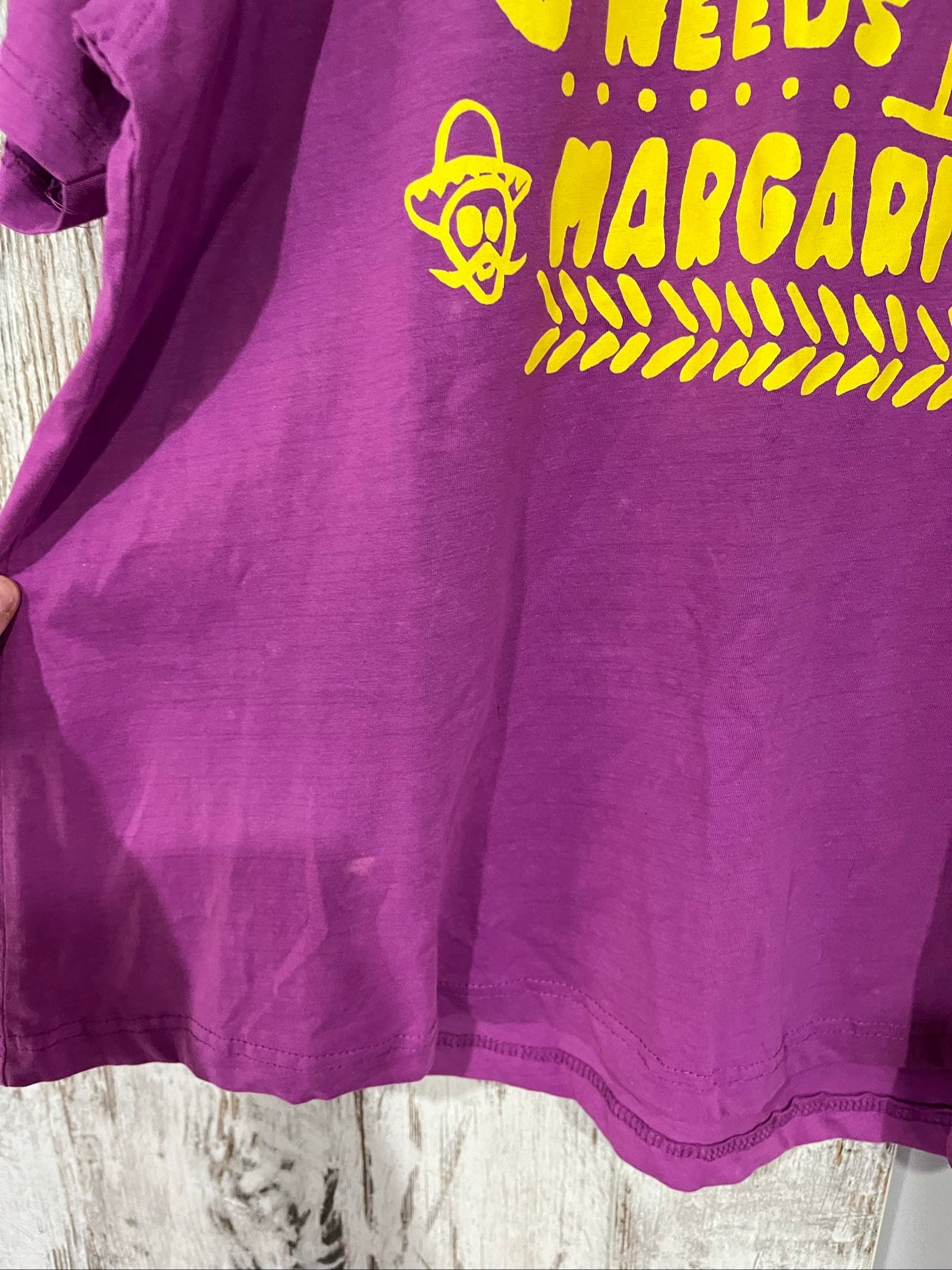 SABBI vintage graphic t-shirt purple with bold yellow front and multicoloured back print.