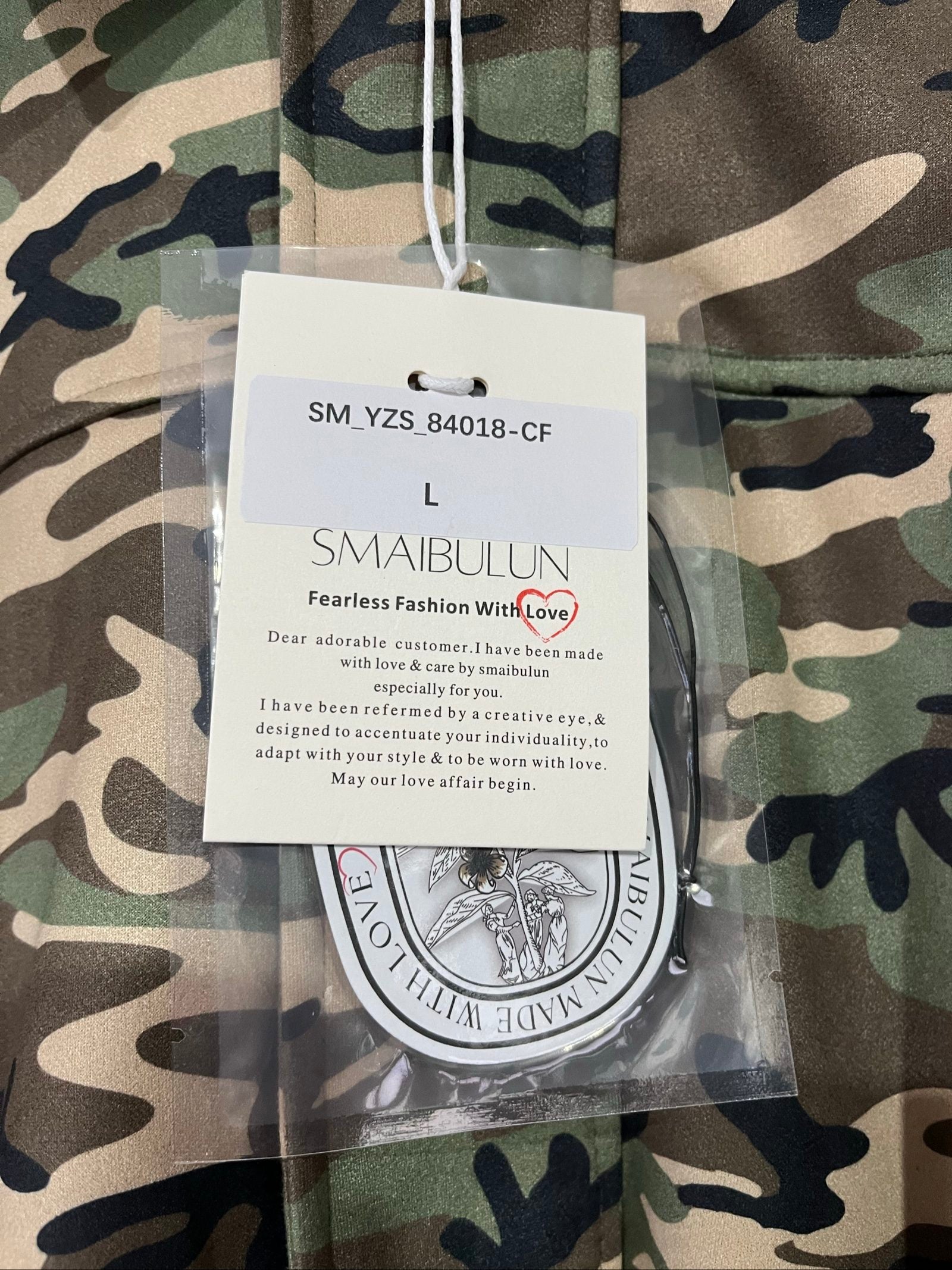 Smaibulun camouflage suede jacket in green, beige, and black with collared design and front zipper.