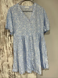 DEA blue and white floral button-up dress with fabric-covered buttons and gathered waist seam.