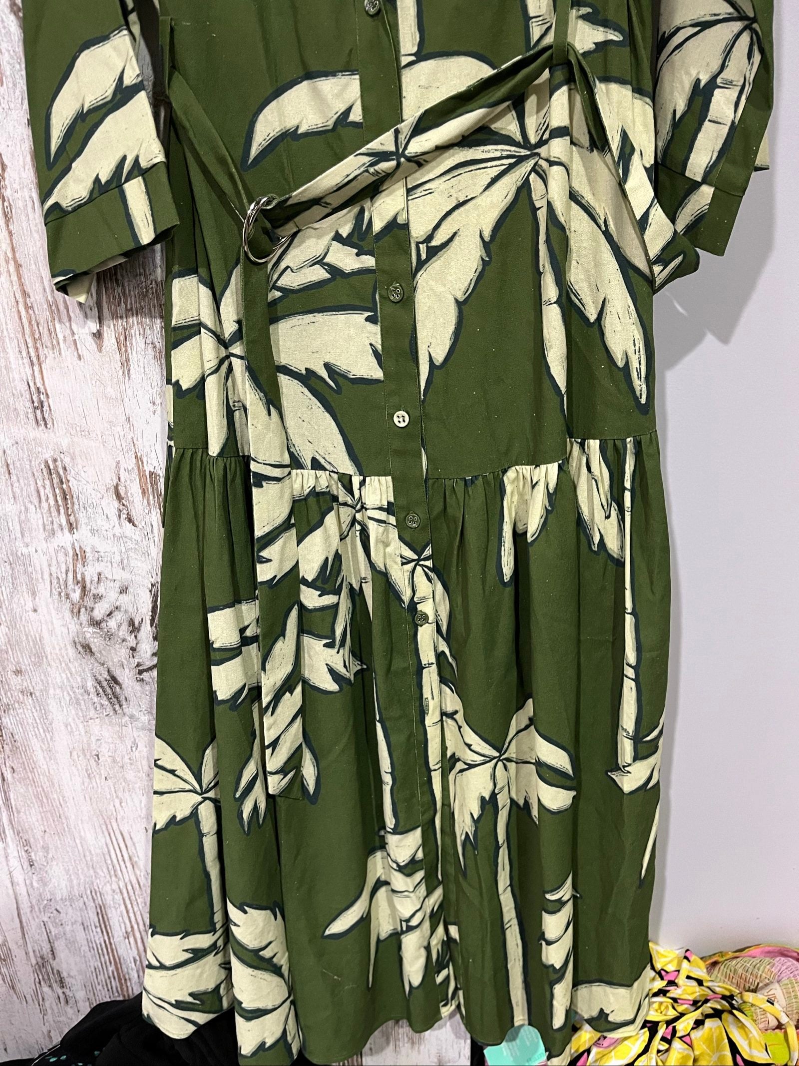 WE ARE THE OTHERS olive maxi dress with cream palm print, button-down style, cotton fabric.