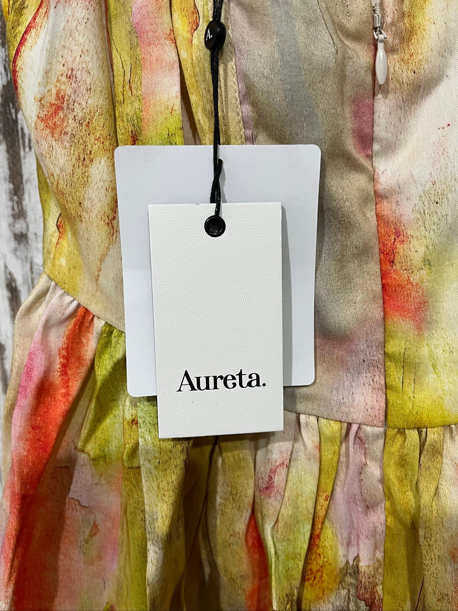 Aureta Studios multi-coloured abstract print corset dress with adjustable straps and gathered waist.