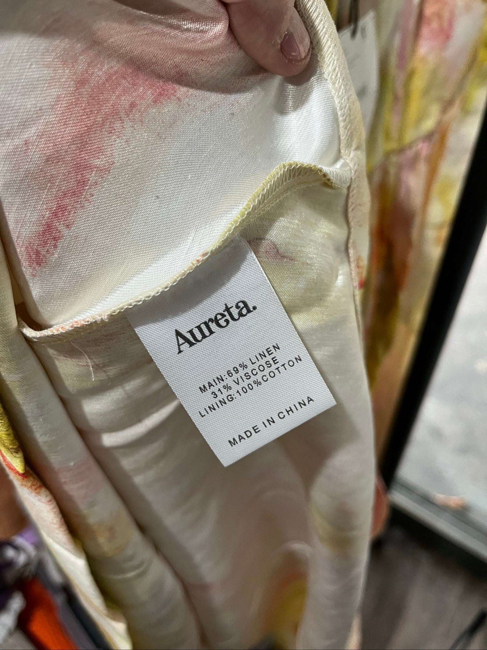 Aureta Studios multi-coloured abstract print corset dress with adjustable straps and gathered waist.