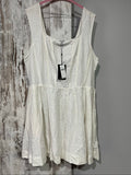 Aureta white sleeveless dress with gathered waist and smocked back detailing.