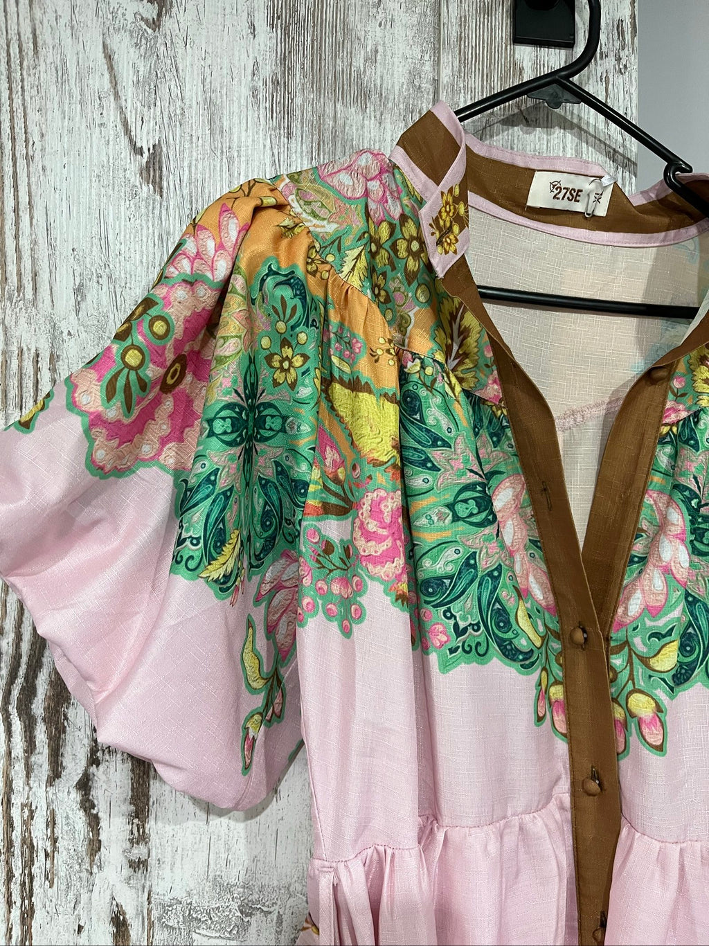 27SE brown midi dress with pink and green floral print, short puff sleeves, matching belt.