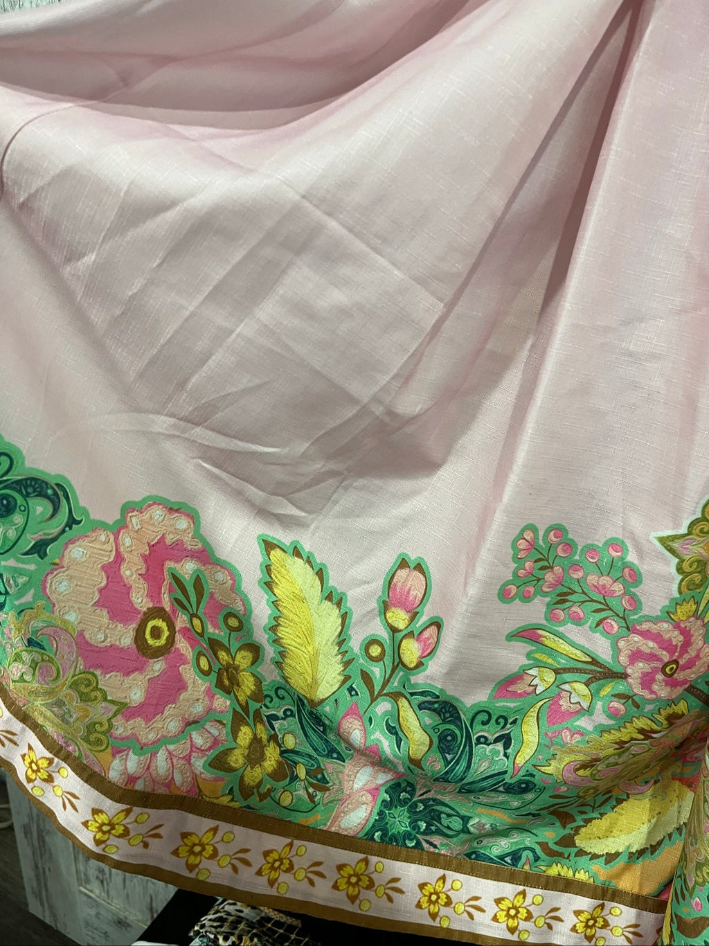 27SE brown midi dress with pink and green floral print, short puff sleeves, matching belt.