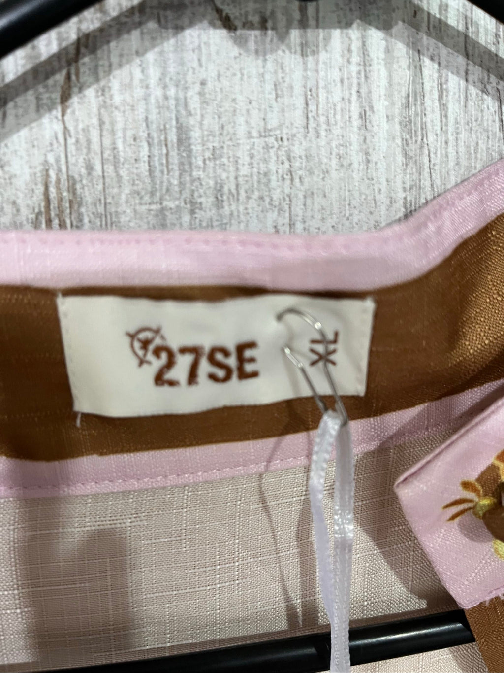 27SE brown midi dress with pink and green floral print, short puff sleeves, matching belt.