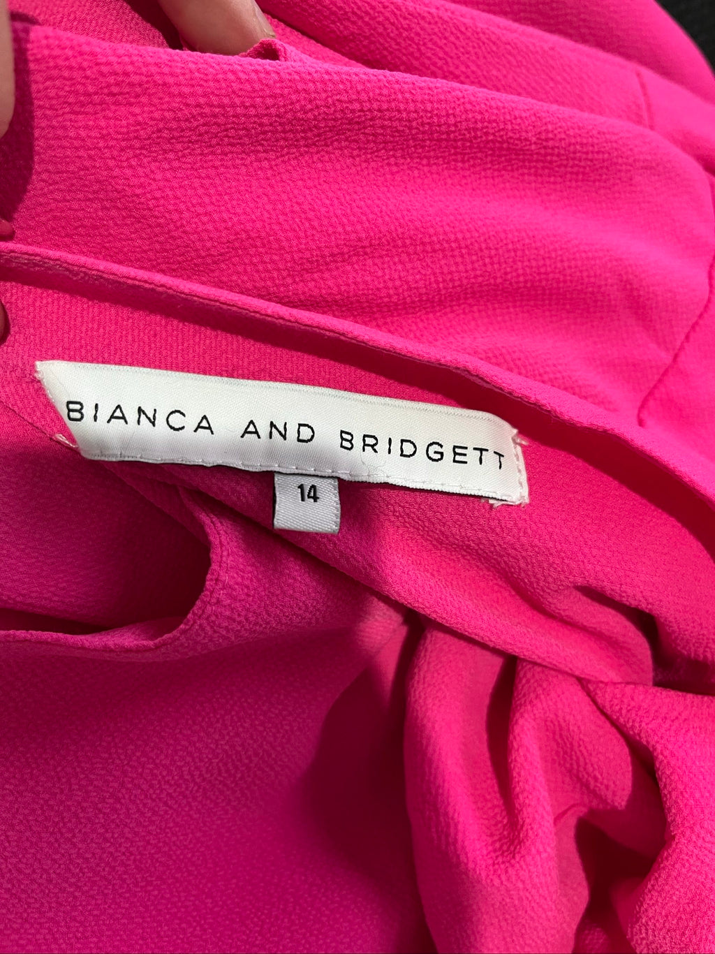 Bianca and Bridget pink one shoulder dress with tie belt and textured fabric.