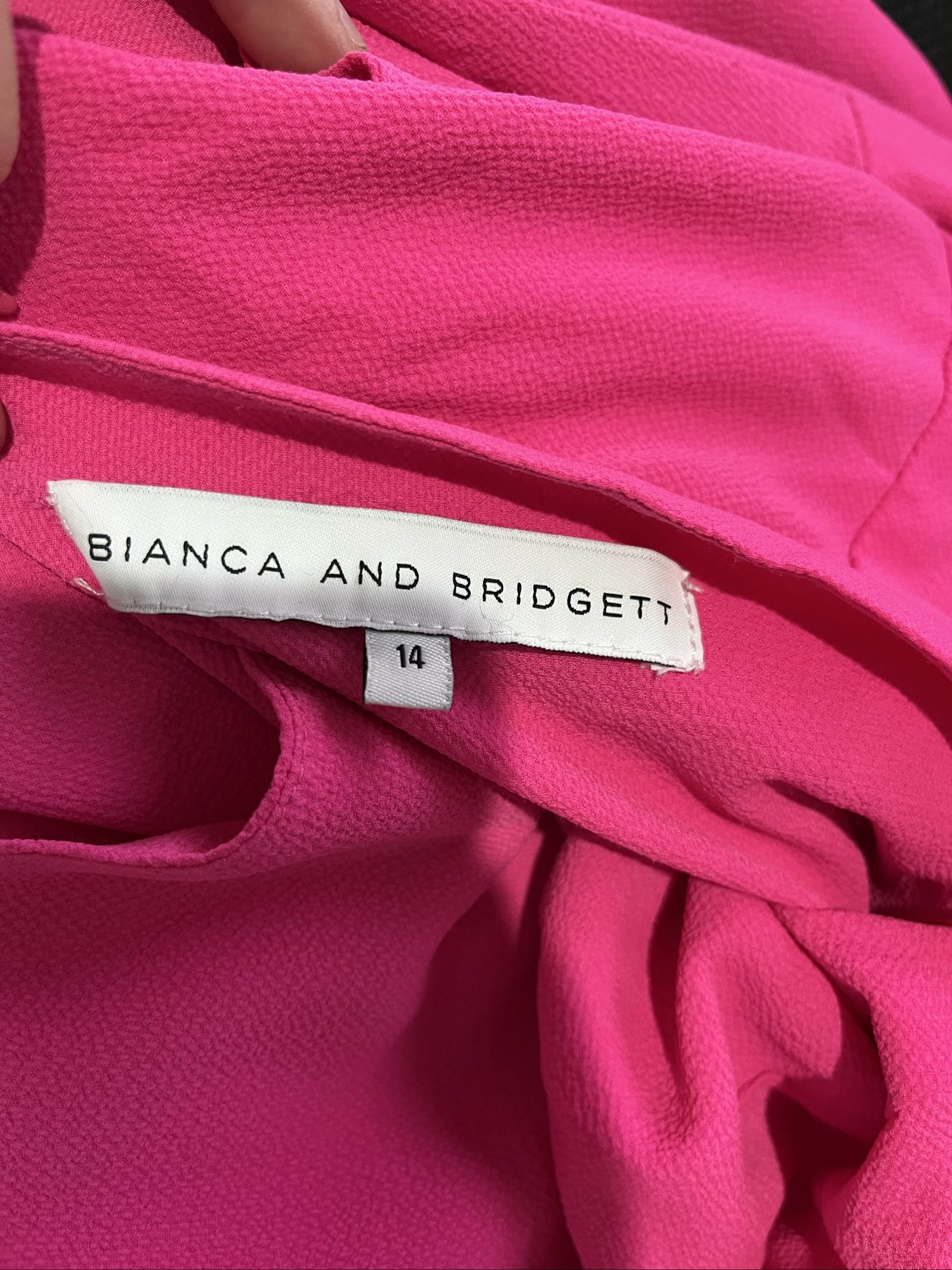 Bianca and Bridget pink one shoulder dress with tie belt and textured fabric.