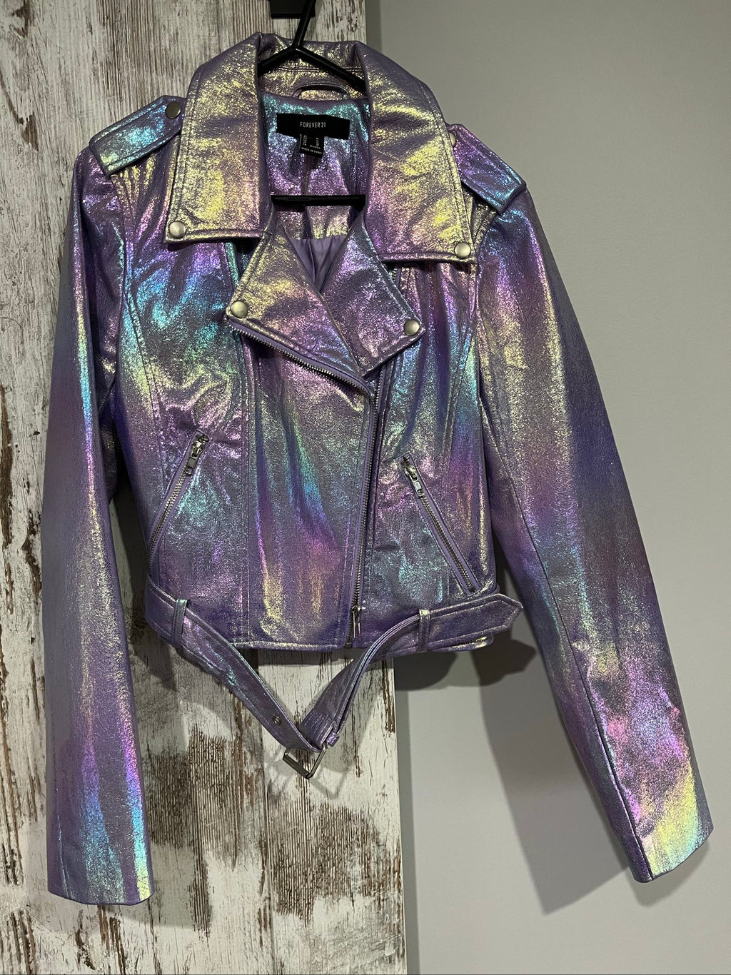 Forever 21 purple iridescent faux leather biker jacket with belted waist and zippered pockets.
