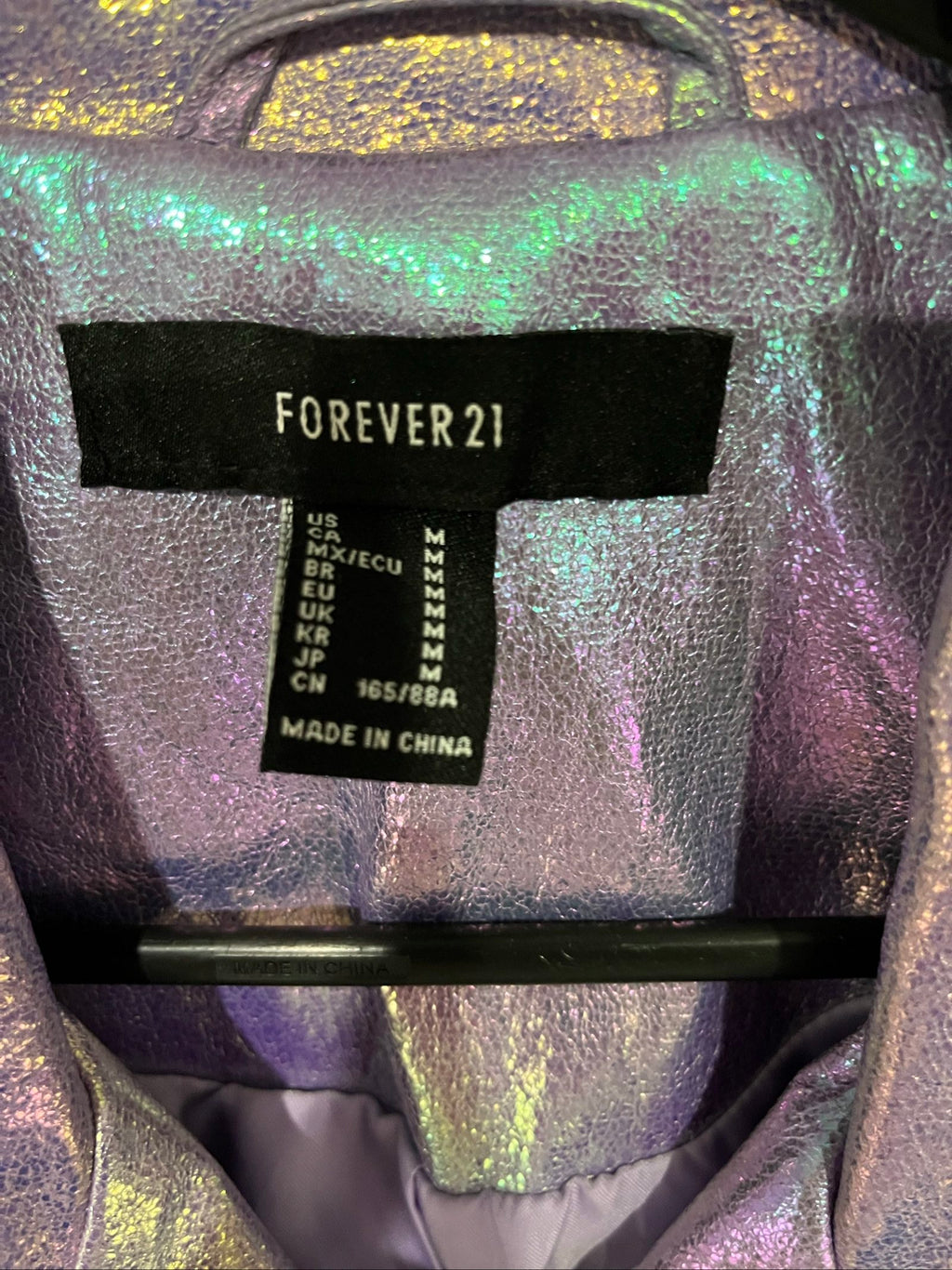 Forever 21 purple iridescent faux leather biker jacket with belted waist and zippered pockets.