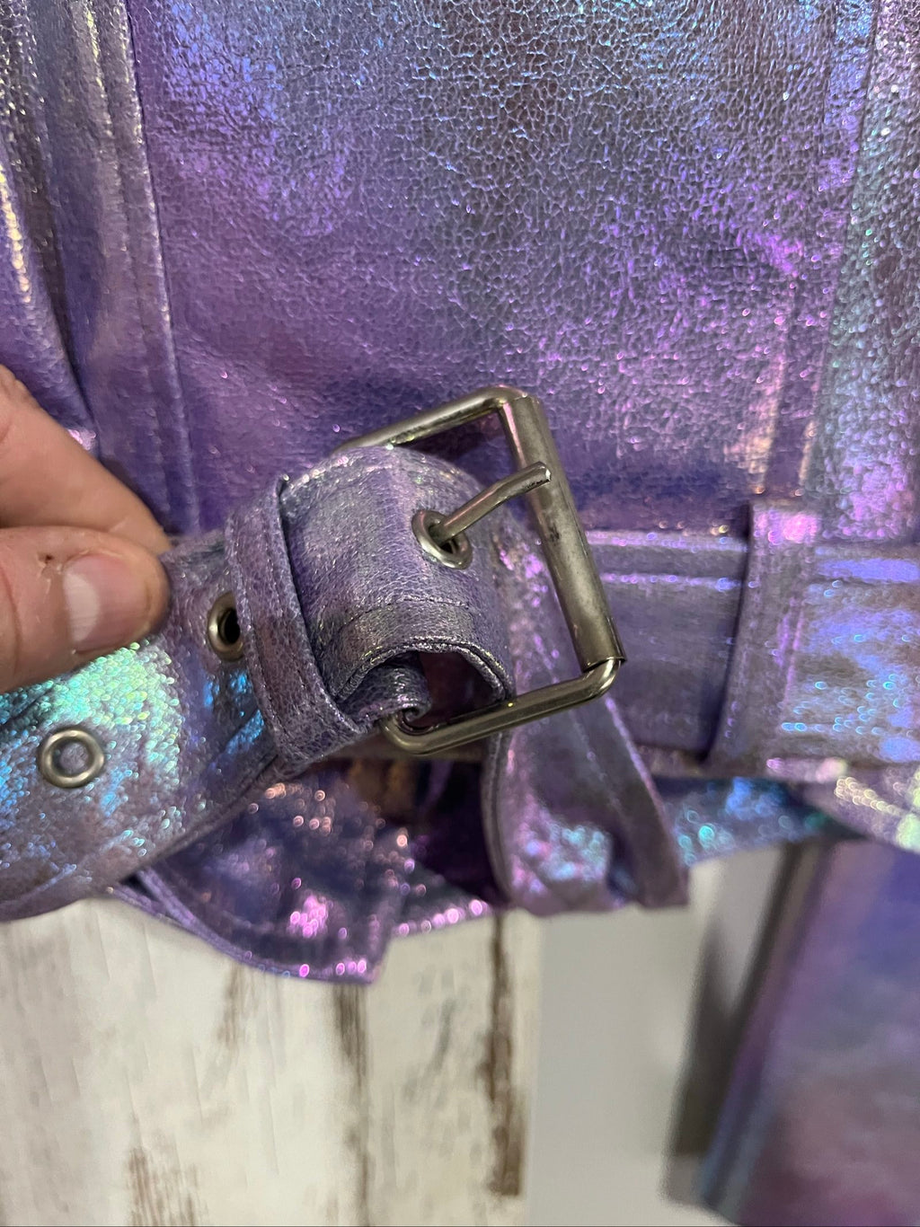 Forever 21 purple iridescent faux leather biker jacket with belted waist and zippered pockets.