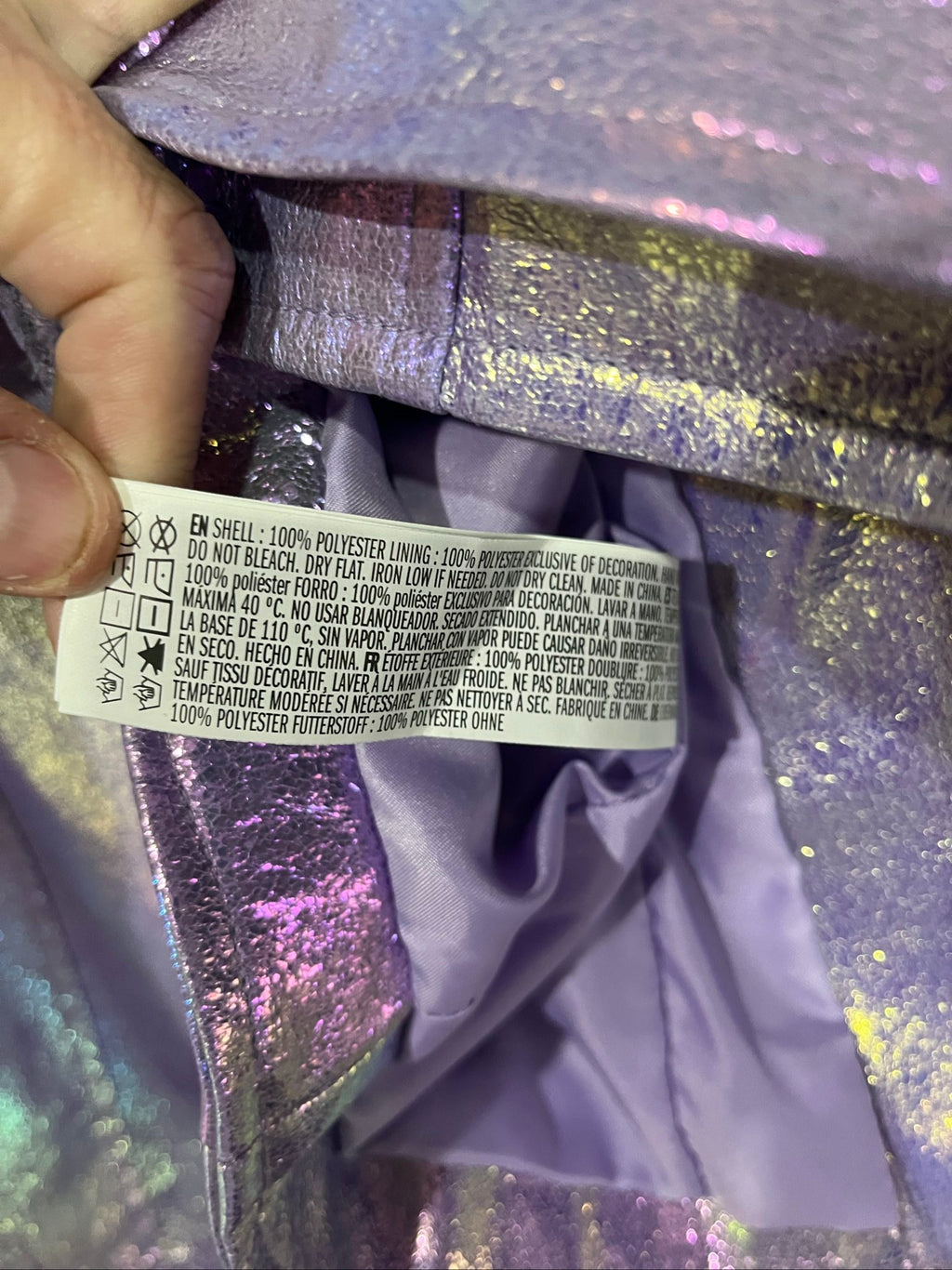 Forever 21 purple iridescent faux leather biker jacket with belted waist and zippered pockets.