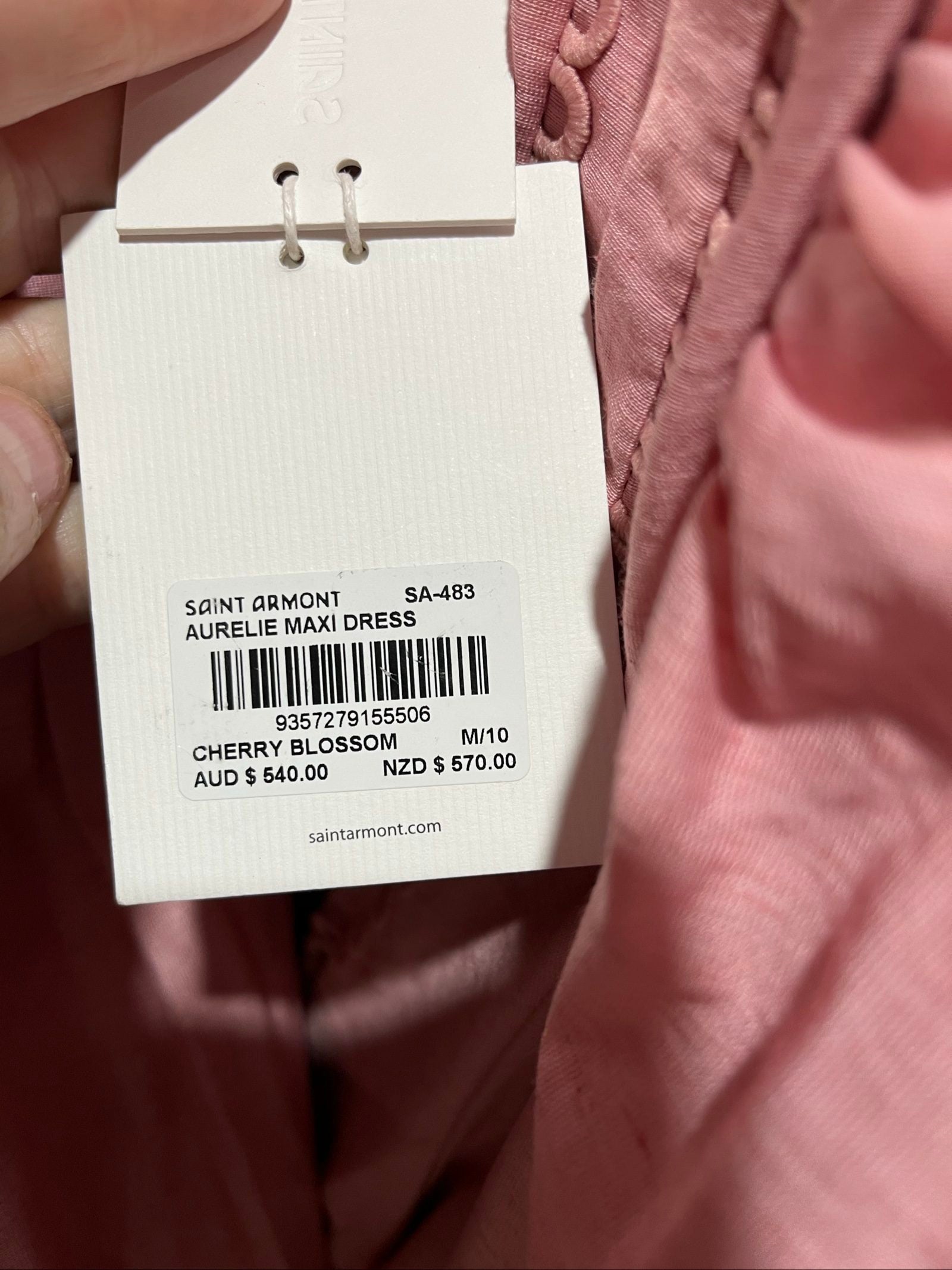 SAINT ARMONT pink midi dress with decorative trims, belted waist, and puffed sleeves.