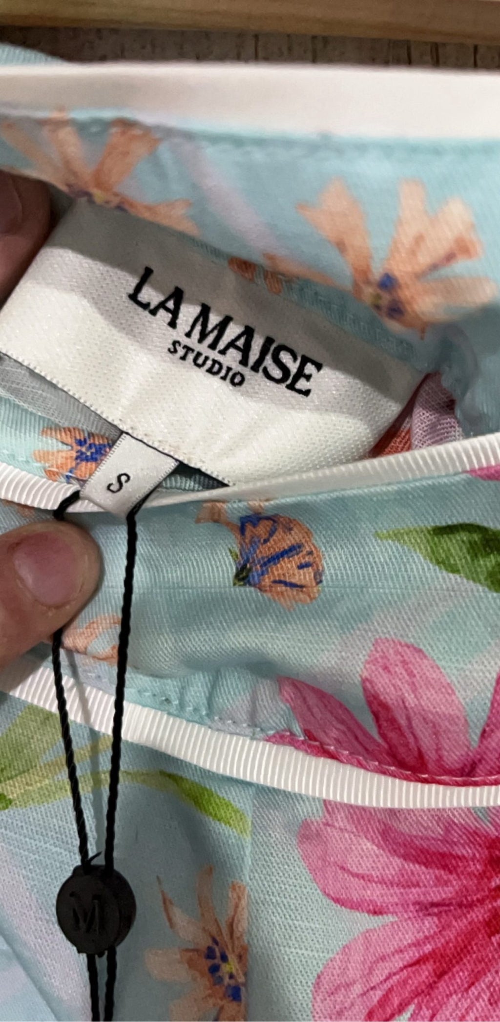 LA MAISE blue floral pants with pink and orange patterns, white trim piping detail.