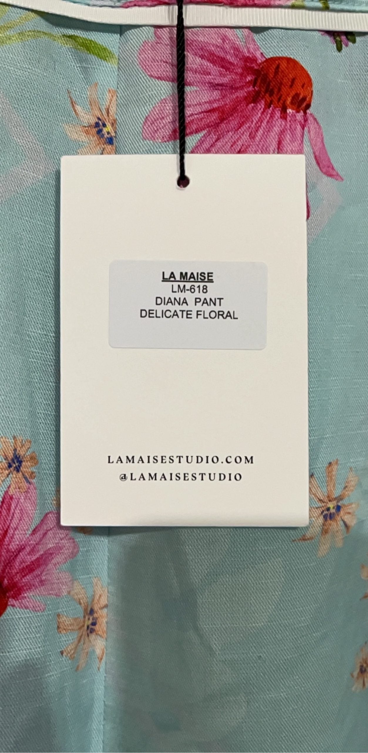 LA MAISE blue floral pants with pink and orange patterns, white trim piping details.