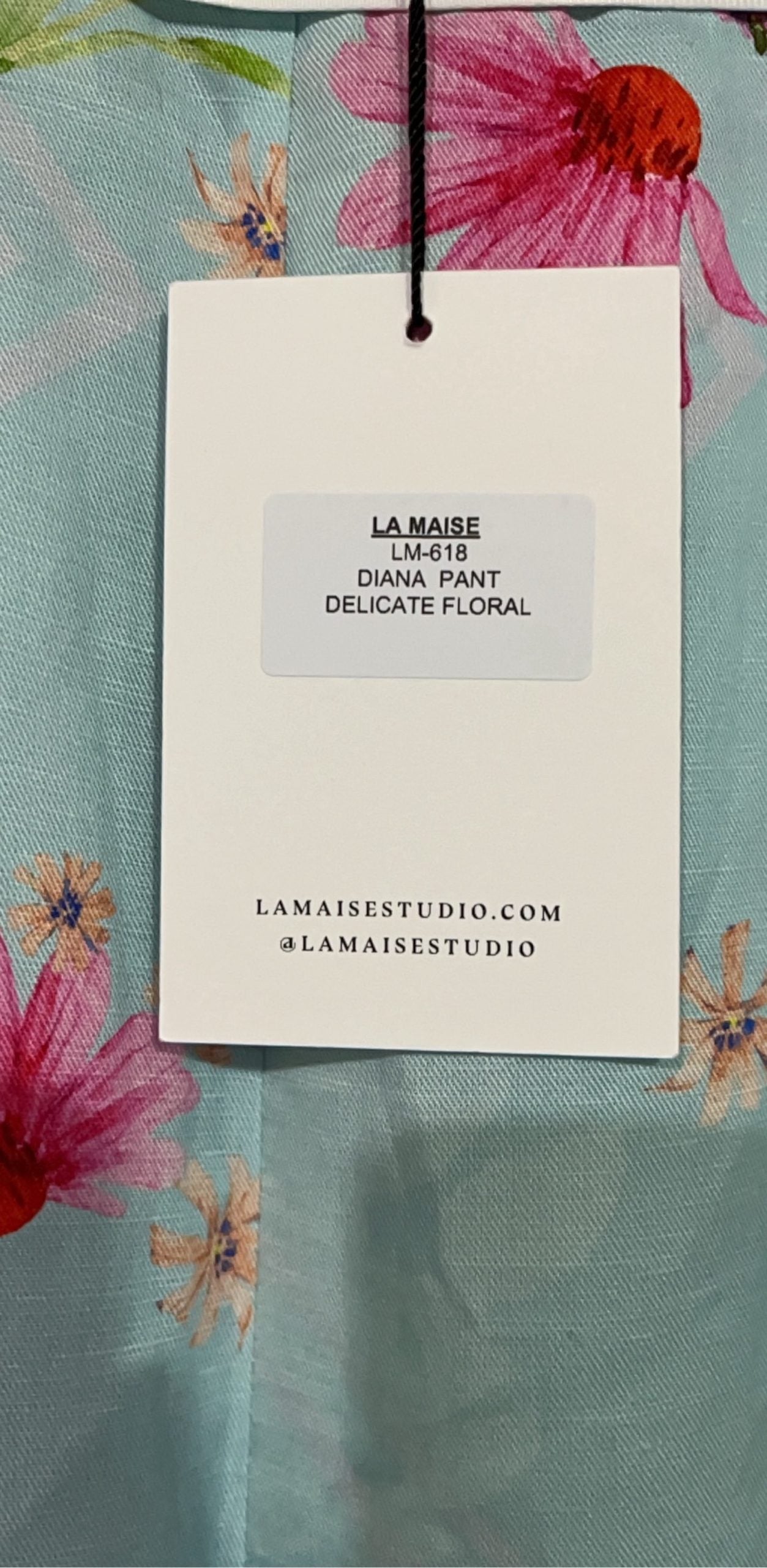 LA MAISE blue floral pants with pink and orange patterns, white trim piping details.