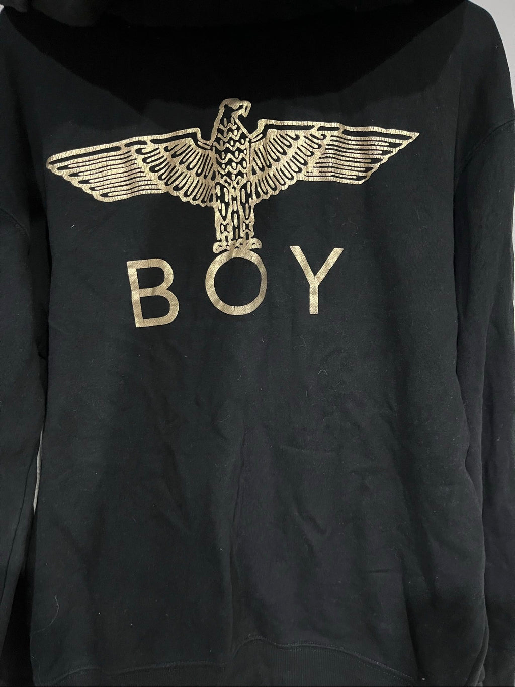 Boy London black zip-up hoodie with gold chain print and logo patch details.