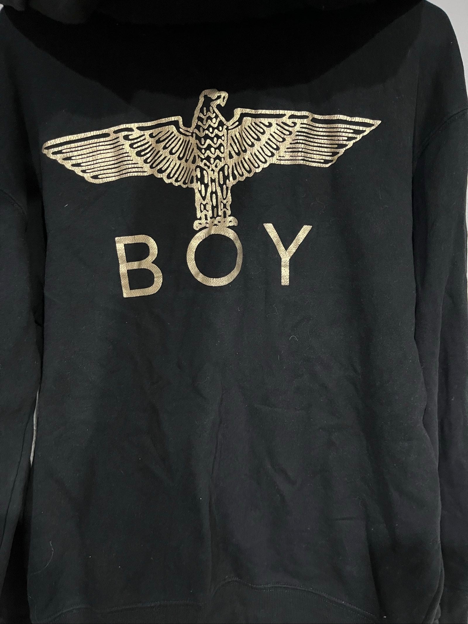 Boy London black zip-up hoodie with gold chain print and logo patch details.