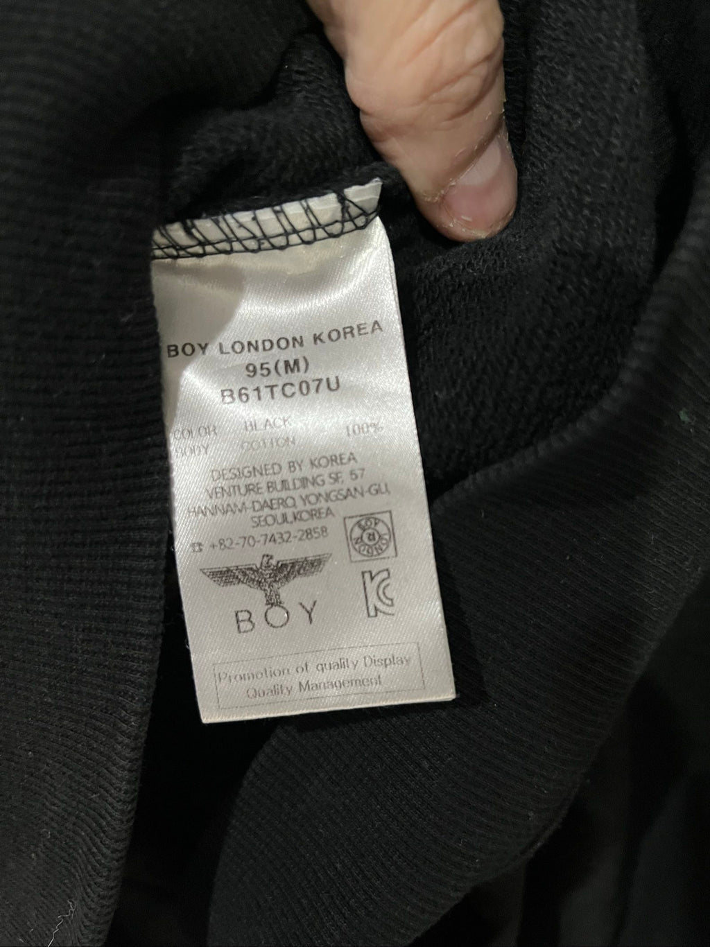 Boy London black zip-up hoodie with gold chain print and logo patch details.