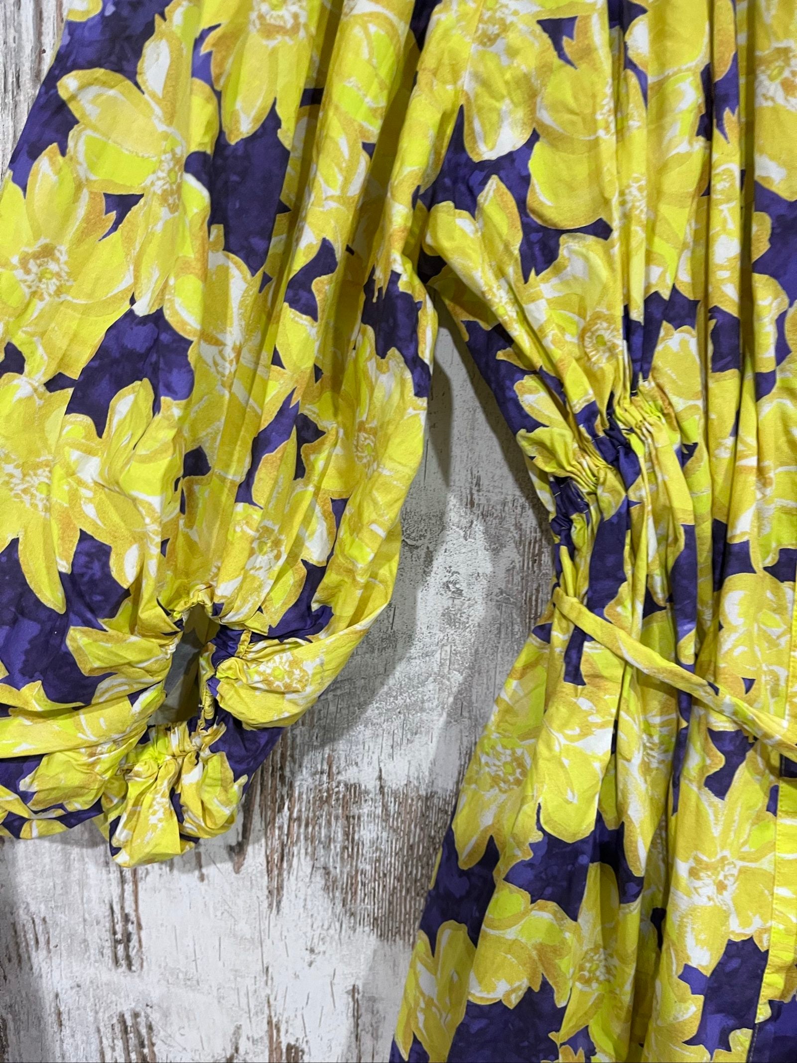 Aureta purple and yellow floral belted blouse with gathered balloon sleeves.