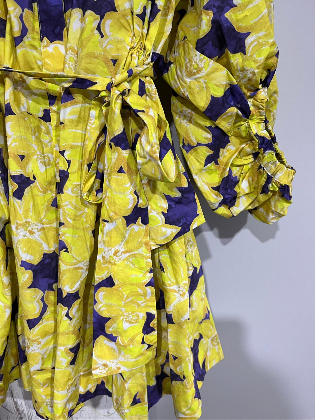 Aureta purple and yellow floral belted blouse with gathered balloon sleeves.