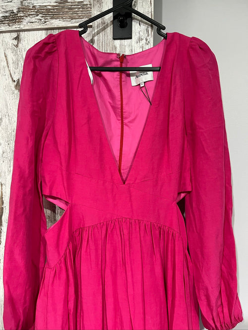 Aureta pink long sleeve maxi dress with cut-out sides and puff sleeves.