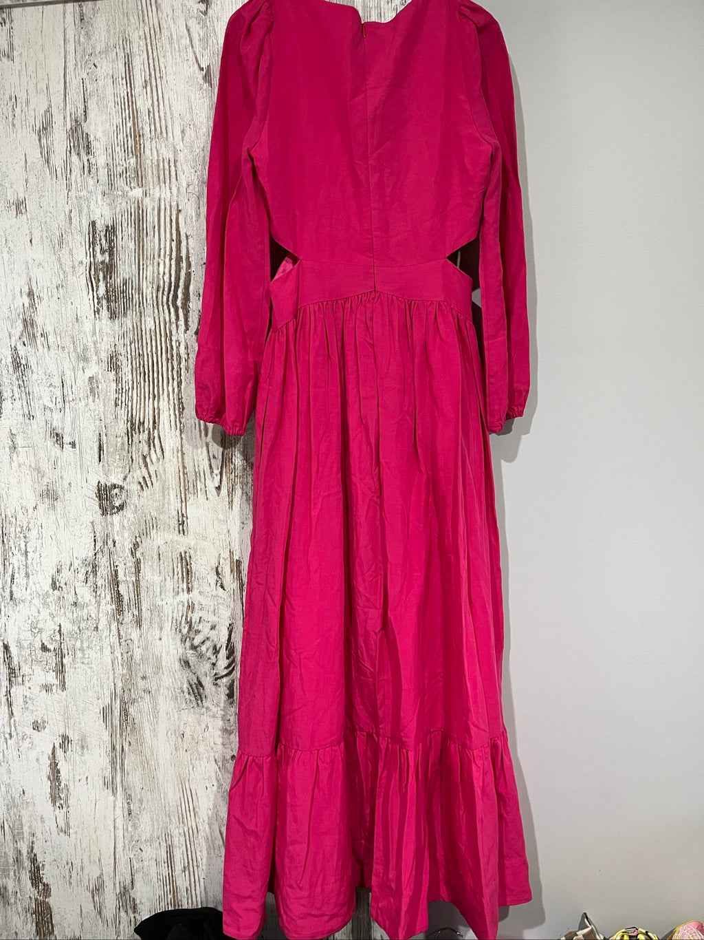 Aureta pink long sleeve maxi dress with cut-out sides and puff sleeves.