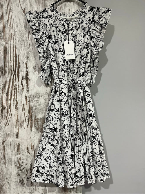 Aureta mini dress black and white abstract floral print with ruffle sleeves and buttons.