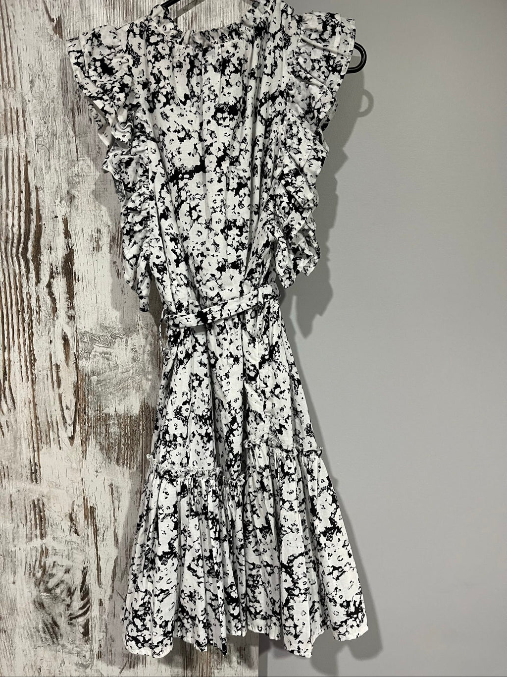 Aureta mini dress black and white abstract floral print with ruffle sleeves and buttons.