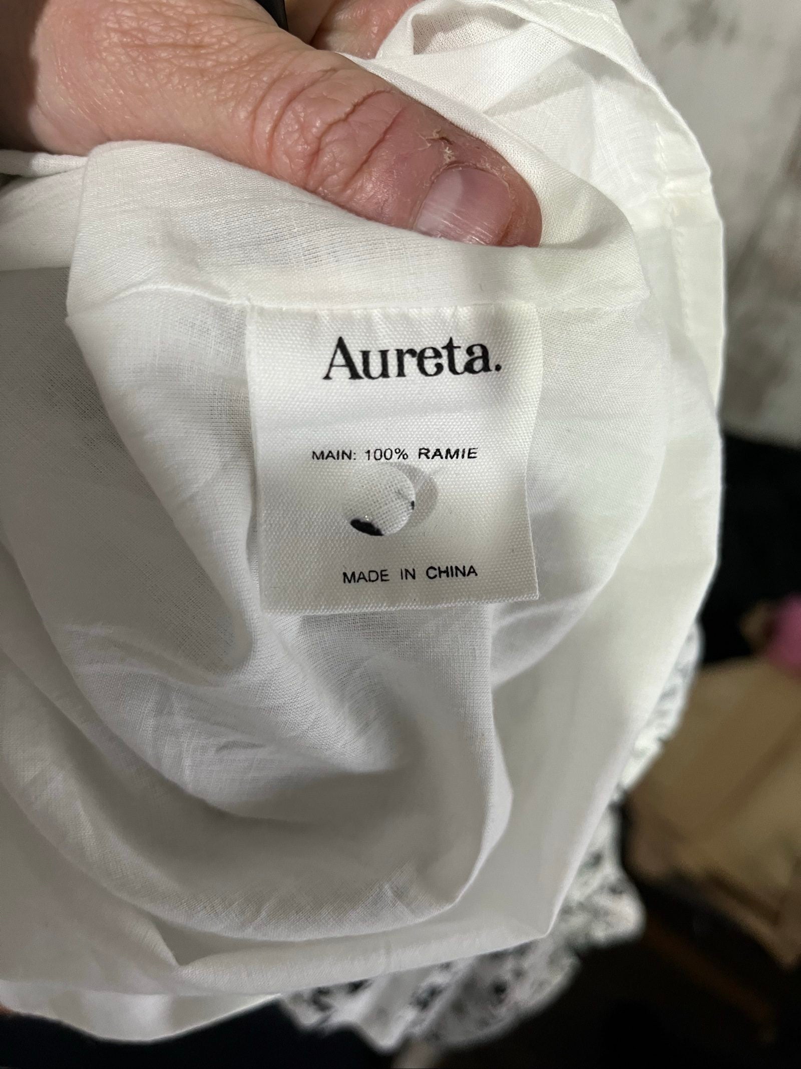 Aureta mini dress black and white abstract floral print with ruffle sleeves and buttons.