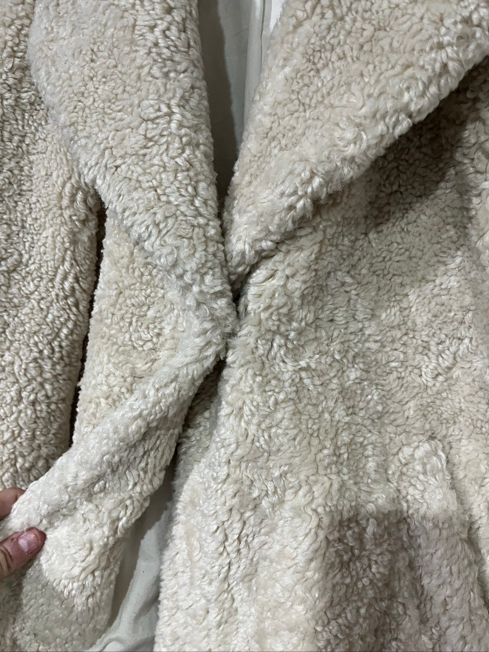 ALC beige faux shearling coat with wide collar and soft plush texture.