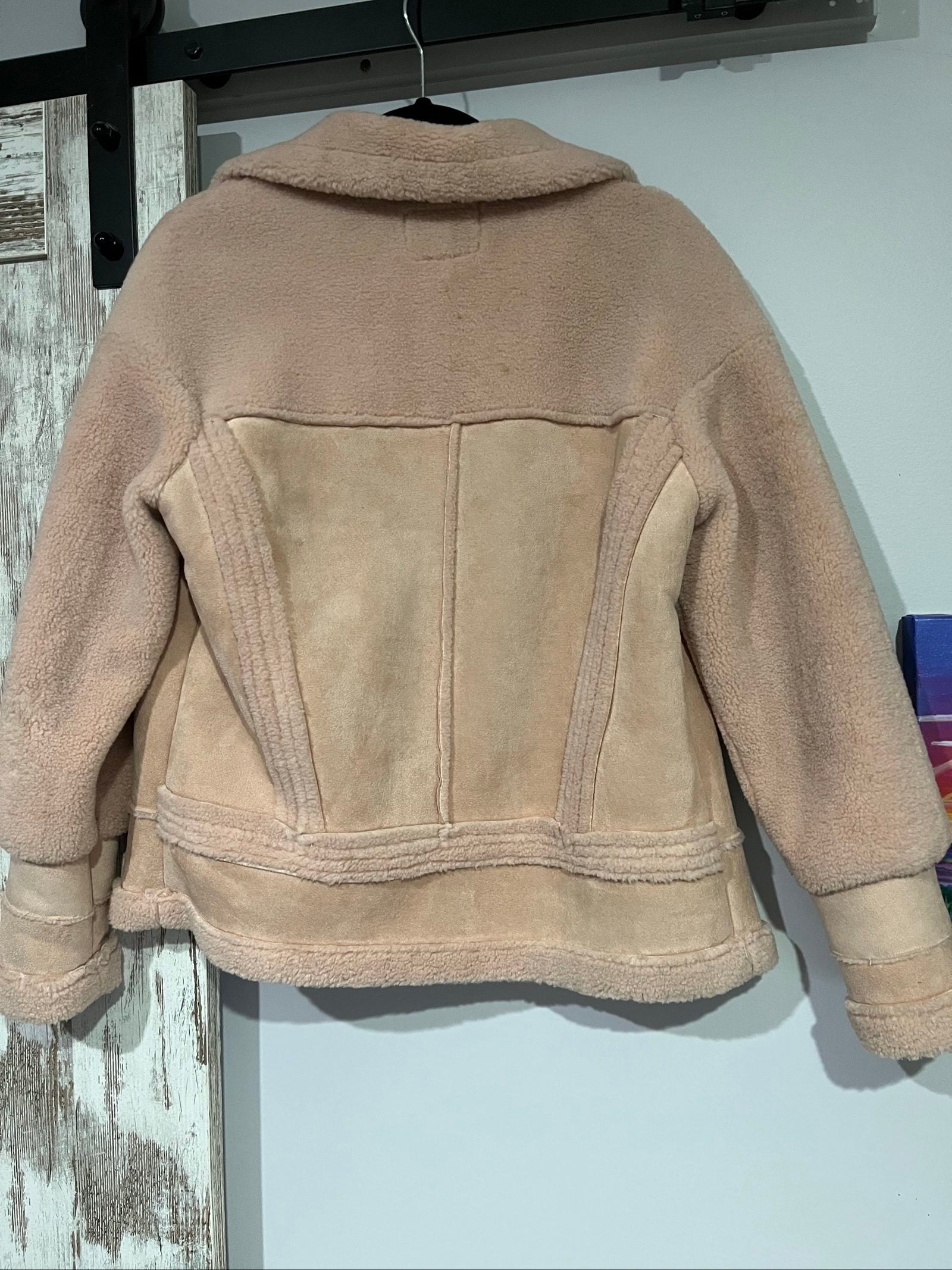 APPARIS beige biker jacket with faux shearling lining, zip-up front, and silver-tone hardware.
