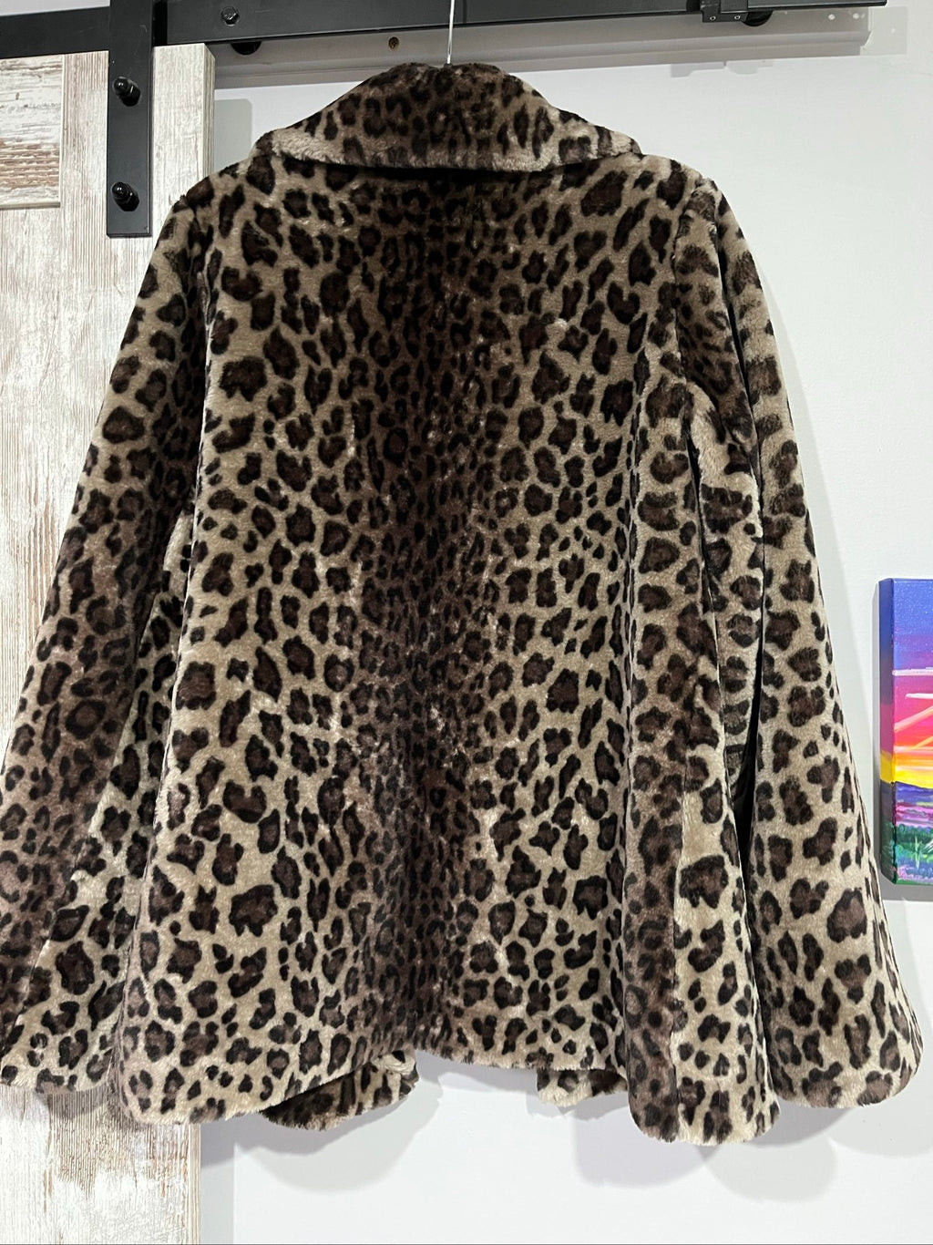 Dennis Basso beige leopard print faux fur coat with wide collar and satin logo lining.