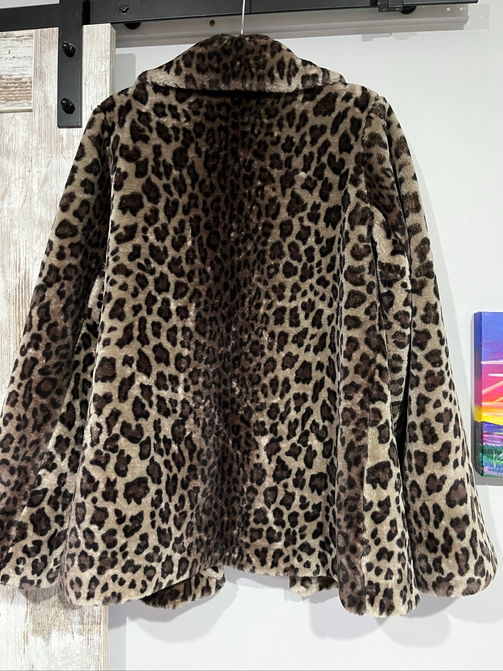Dennis Basso beige leopard print faux fur coat with wide collar and satin logo lining.